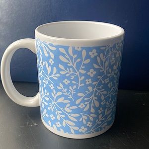 Holiday home coffee mug! White, with a blue background and white flowers on top
